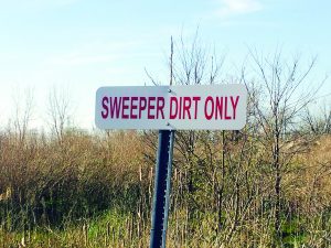 Street cleaning teams regularly dump sweeper dirt at the corner of North Avenue and 11th Street as a temporary transport site. Sources say that those piles are sometimes left for months. 