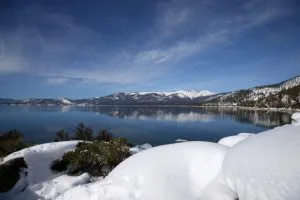 Snow covers the Sierra Nevada mountains and the shoreline of Lake Tahoe on Monday, Jan. 30, 2017, near Memorial Point, Nevada. (Aric Crabb/Bay Area News Group)