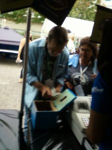 Sporting lanyards with photo ID's would lead you to believe that these are Venue Management employees scooping out the tip box. The tips did not make their way to the festival volunteers. Did they accrue to a Fortune 50 company's bottom line?