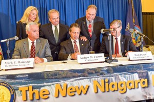Gov. Andrew Cuomo [center] promised in 2013 a new Niagara. It was tied in part to the tipping point Hamister hotel which has not been built largely because Cuomo's campaign contributor and developer Mark Hamister [left] does not have the financing to build it. Hamister has inflated the price of the proposed hotel by 100 percent in order to falsely qualify for more taxpayer funding. The new Niagara is much like the old Niagara.