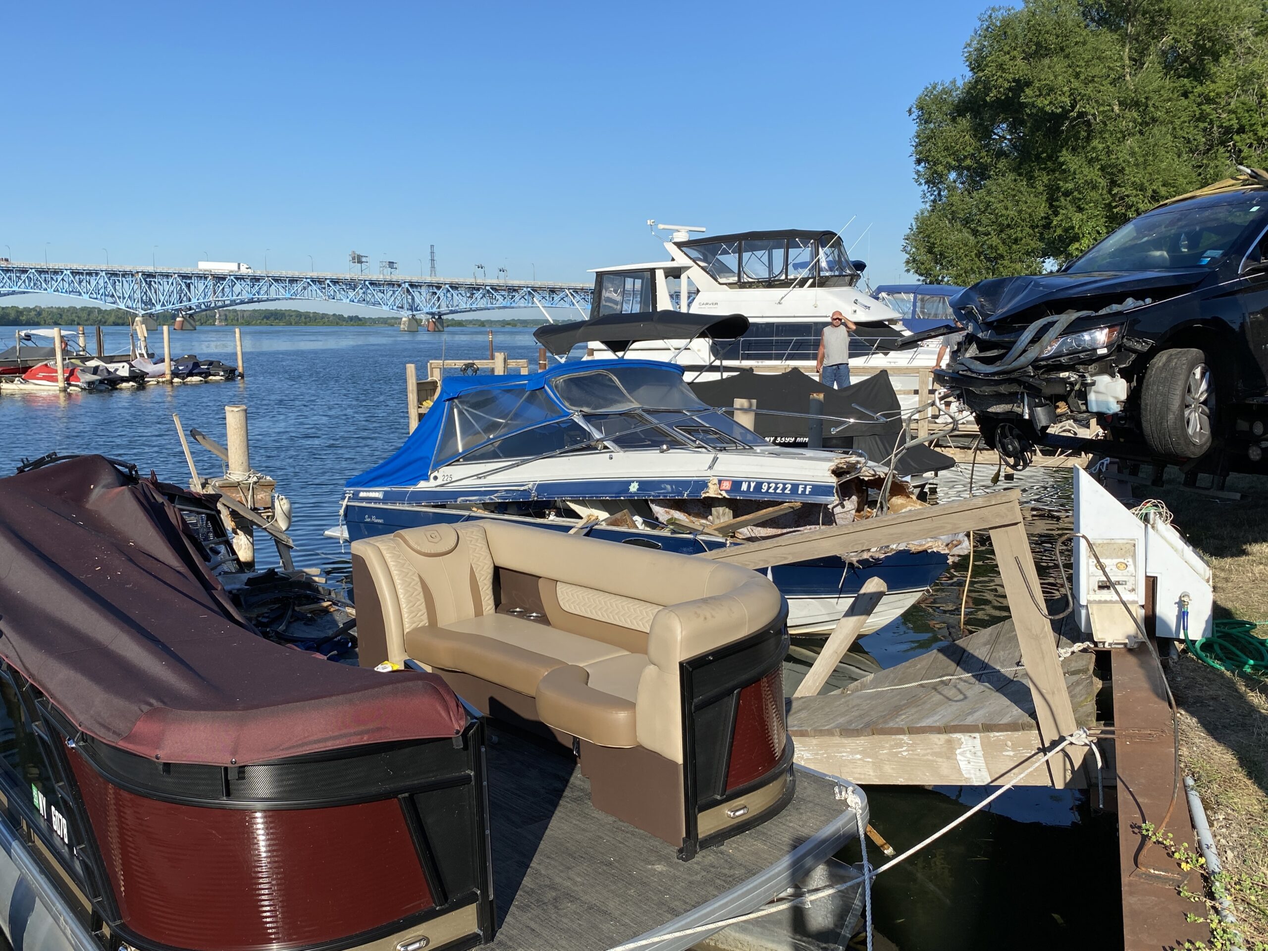 Spider Attack Causes Driver to Lose Control of Vehicle; Crash into Boats Docked at Yacht Club