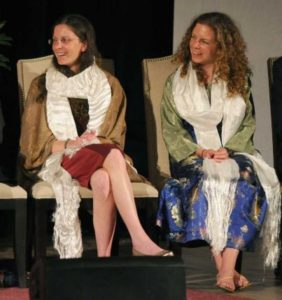 On stage with the Dalai Lama. How much it cost the two heiresses for this moment is anybody’s guess.