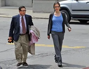 Clare Bronfman with her attorney William Savino. Savino drew up her verified complaint where she swore under oath that she had no written agreement with Parlato, which contradicts entirely the government's allegation that there was a written agreement. 