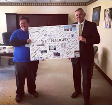 Niagara Falls Memorial Medical Center President & CEO Joseph A. Ruffolo and George Augstell, who will operate the coffee and beverage shop in the new Golisano Center for Community Health, spread awareness and gain pledges for the #SpreadTheWordToEndTheWord Campaign! Take the pledge today at R-word.org!
