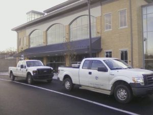  Two city trucks parked outside the train station, with motors idling. Over the years, maintenance and security will also probably turn out to be very costly.