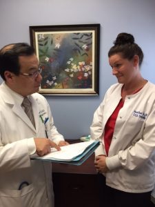  Dr. Won Sam Yi with Heather Slocum               ...CCS Oncology CEO says cancer care provider being dropped by Independent Health.