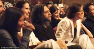 Keith Raniere and Nancy Salzman listen to the Dalai Lama speak in Albany.