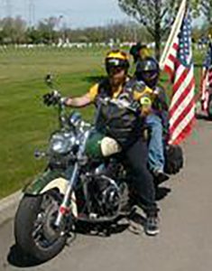 Big Al Cutaia on his bike with an unidentified child.