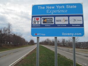  "Motherboard" sign on the north Moses Parkway is deemed by the Federal Highway Administration to be distracting and in violation of federal regulations.