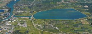 The Lewiston Reservoir (background) contains billions of gallons of water. The federal government recently ordered NYPA to update emergency flooding plans in light of possible leaking. The village of Lewiston, the town of Niagara and the Tuscarora Reservation are located next door to the huge, elevated reservoir.